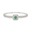 Silver bracelet with a green gemstone on a white background