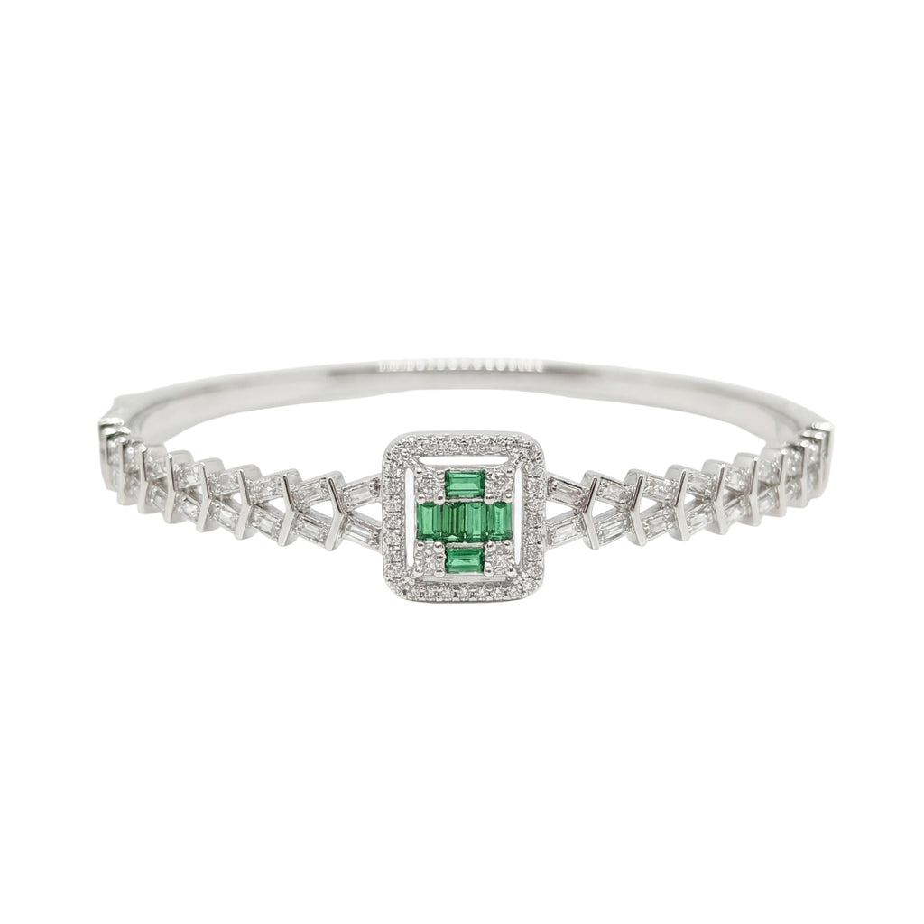 Silver bracelet with a green gemstone on a white background
