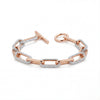 Rose gold chain bracelet with diamond accents on a white background