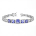 Silver bracelet with purple gemstones on a white background