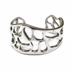Silver cuff bracelet with openwork design on a white background