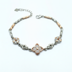 Multicolored bracelet with floral designs on a white background