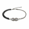 Bracelet with black beads and silver clasp on a white background