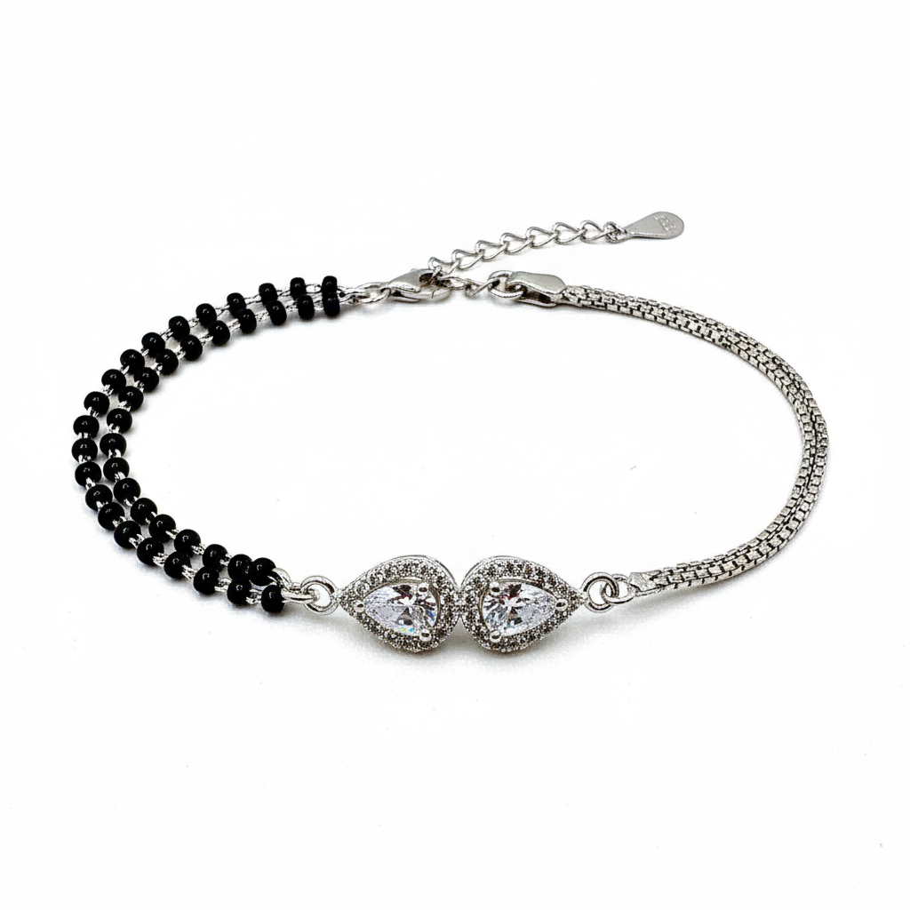 Bracelet with black beads and silver clasp on a white background
