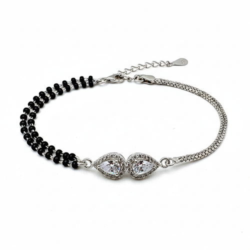 Bracelet with black beads and silver clasp on a white background