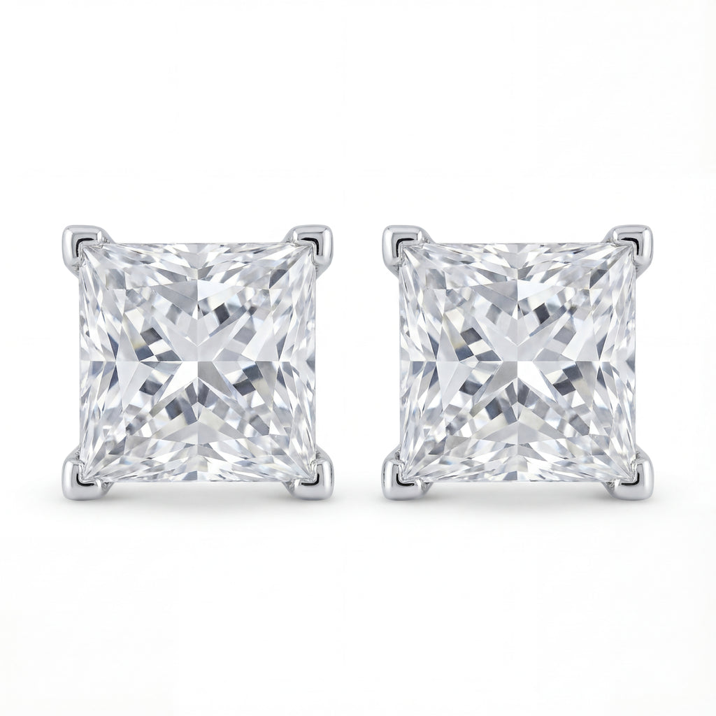Pair of square-cut diamond stud earrings on a white background