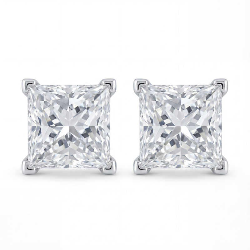 Pair of square-cut diamond stud earrings on a white background