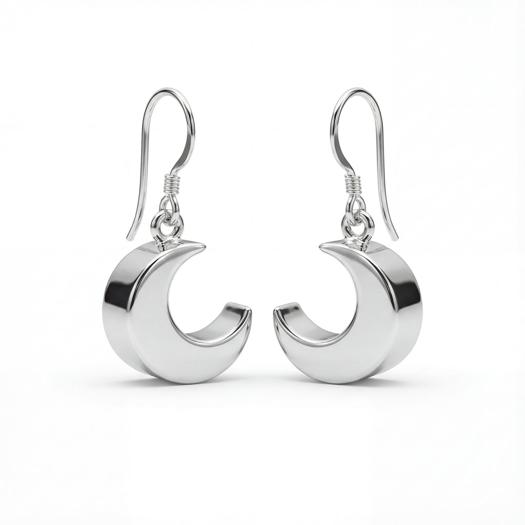Silver crescent moon earrings on a white background