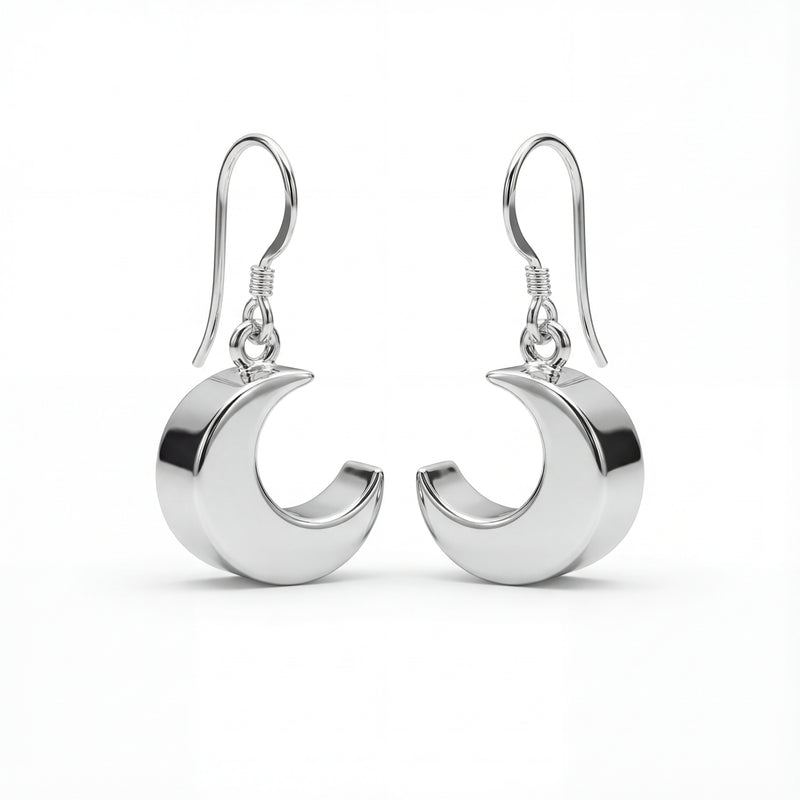 Silver crescent moon earrings on a white background