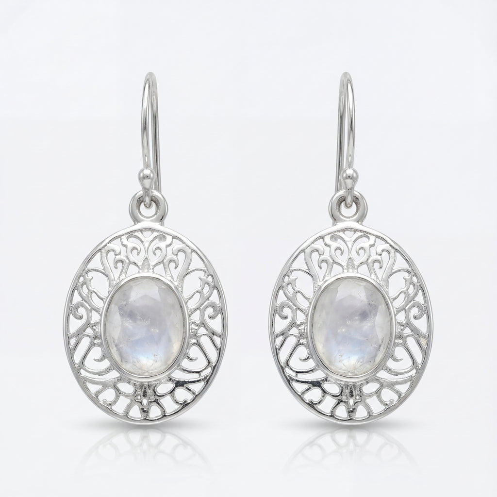 Silver earrings with moonstone stones on a white background