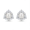 Pair of pearl earrings with diamond accents on a white background