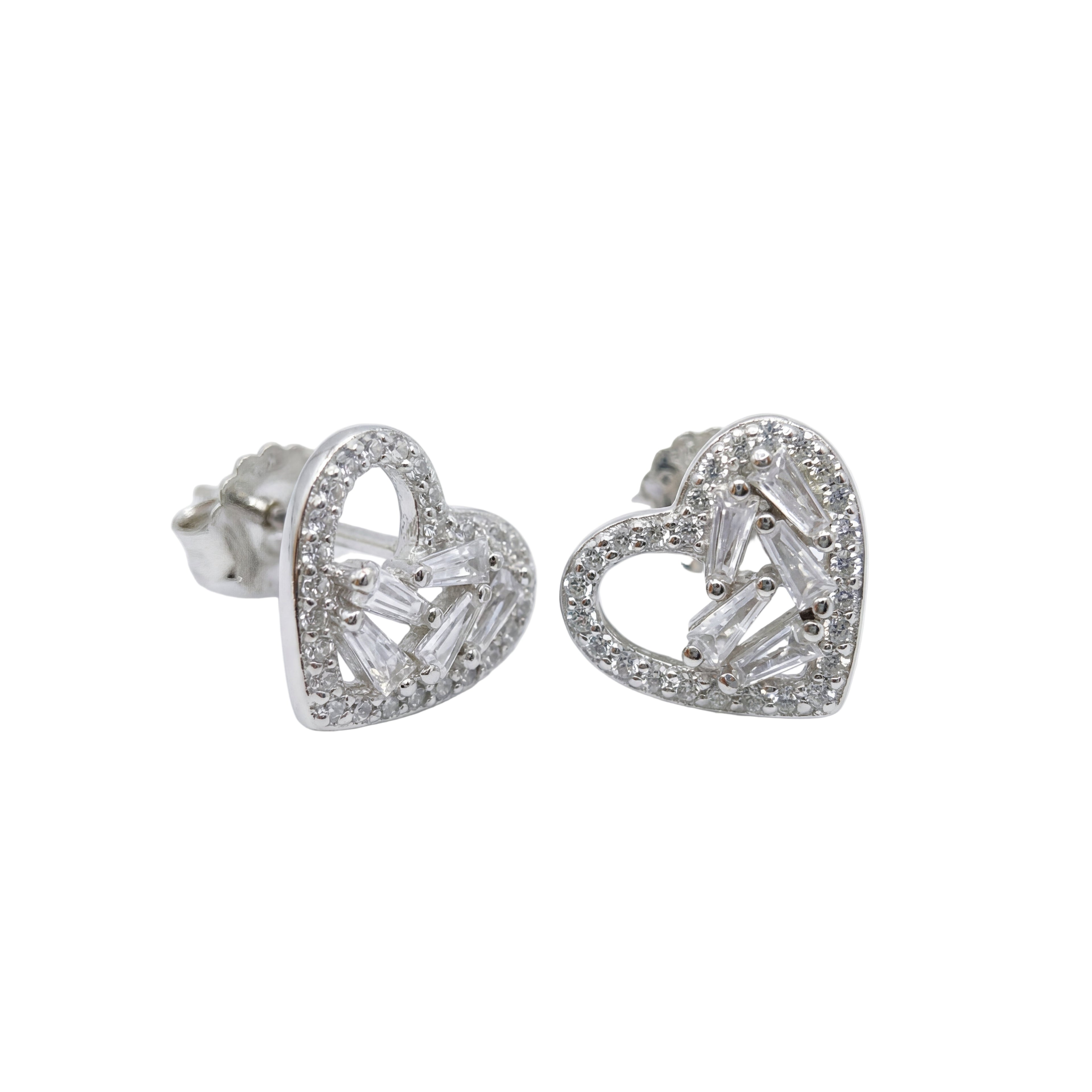 Heart-shaped silver earrings with clear gemstones on a white background