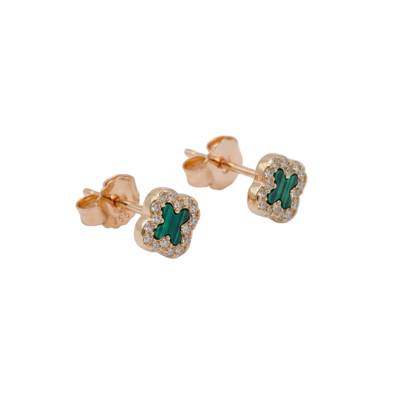 Rose gold earrings with green gemstones on a white background
