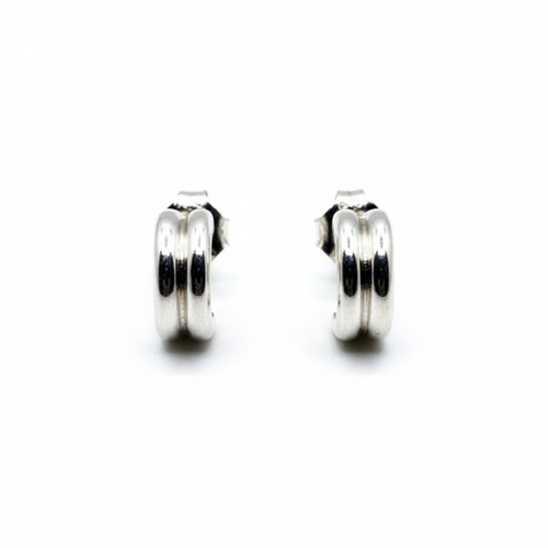 Pair of silver hoop earrings on a white background
