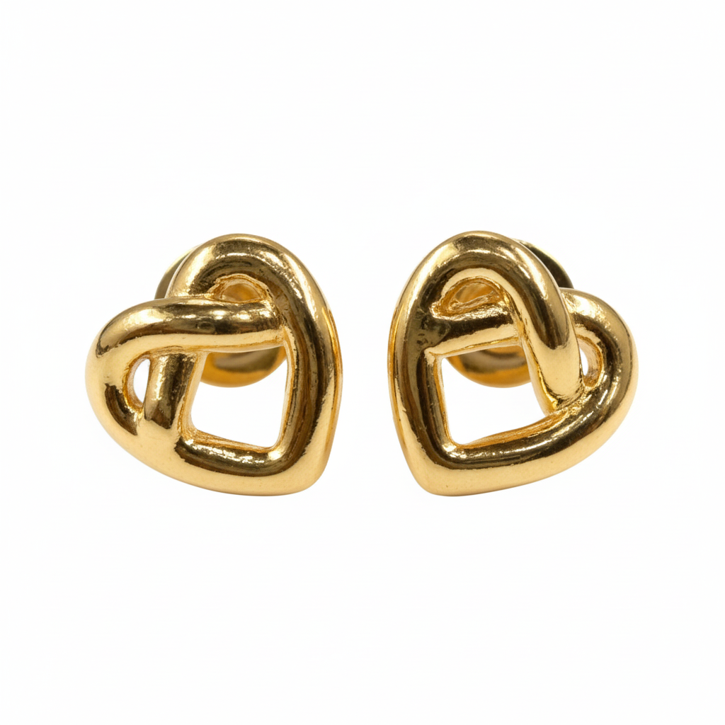 Pair of gold knot-shaped earrings on a white background