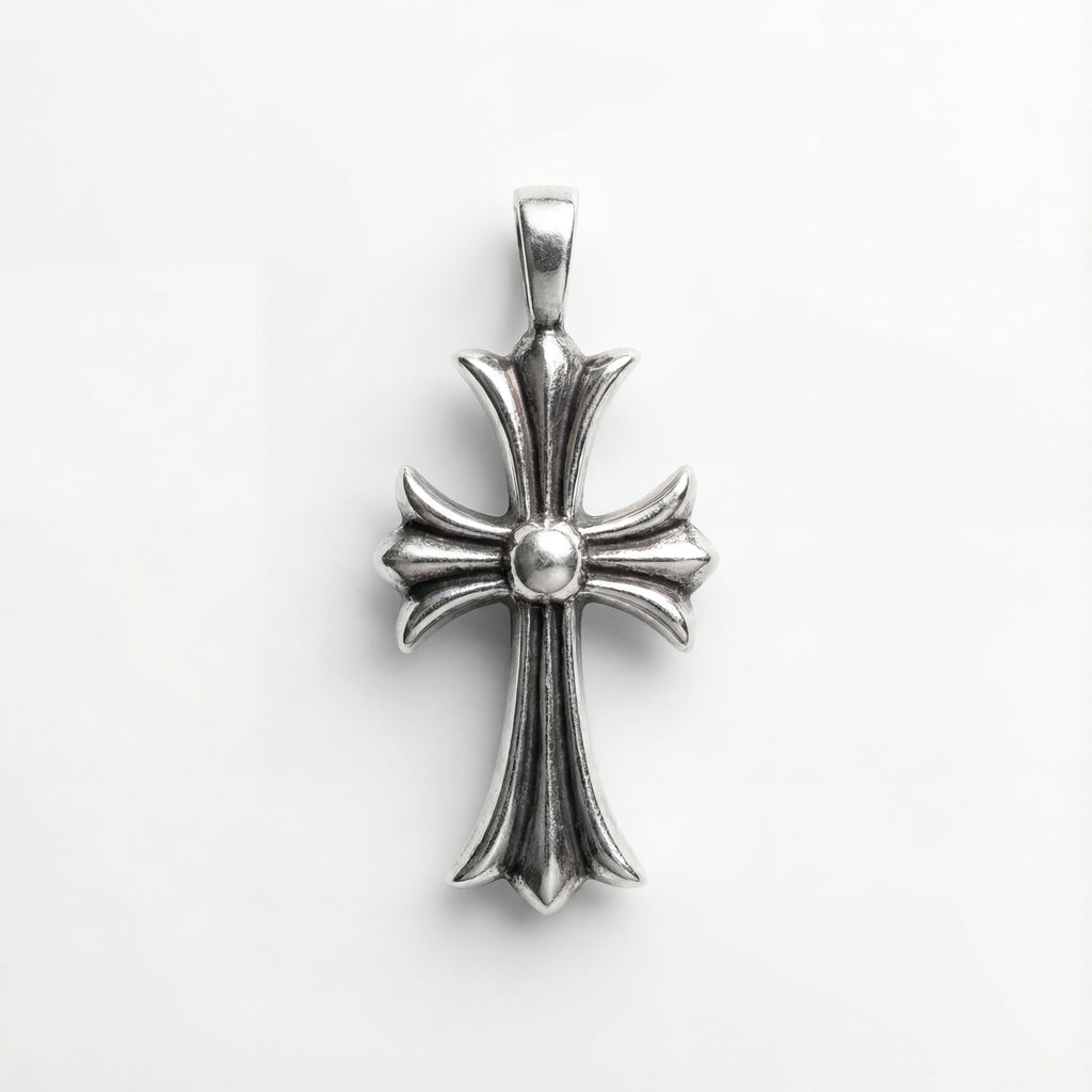 Silver cross pendant on a white background