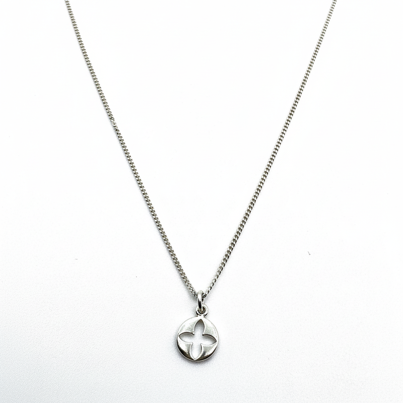 Silver necklace with a floral pendant on a white background