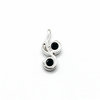 Silver pendant with black gemstones on a white background