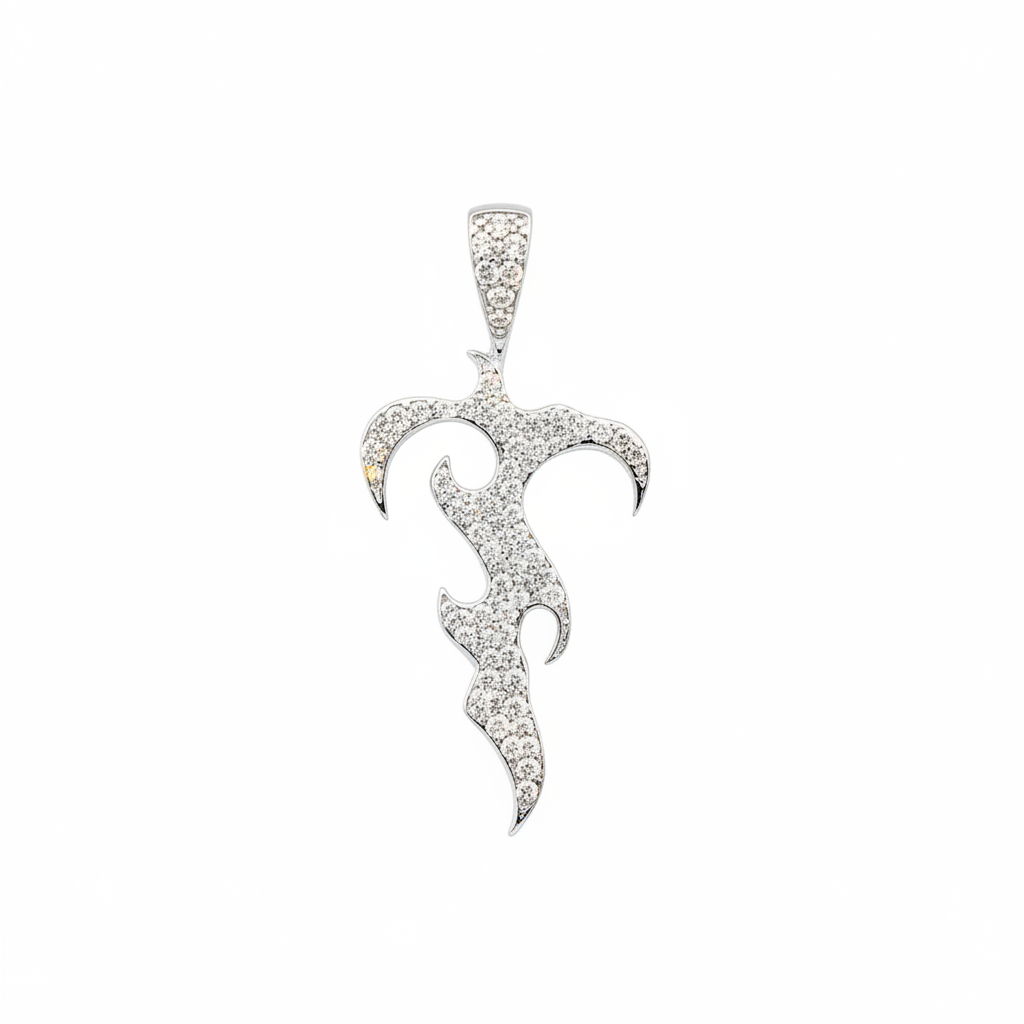 Silver pendant with intricate design on a white background