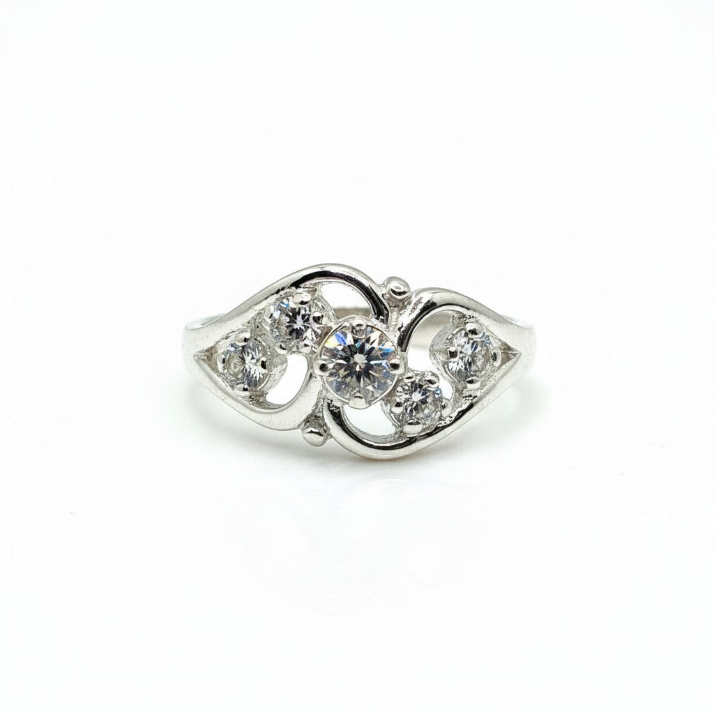 Silver ring with clear gemstones on a white background