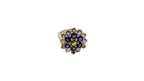 Jewelry ring with multicolored gemstones on a white background