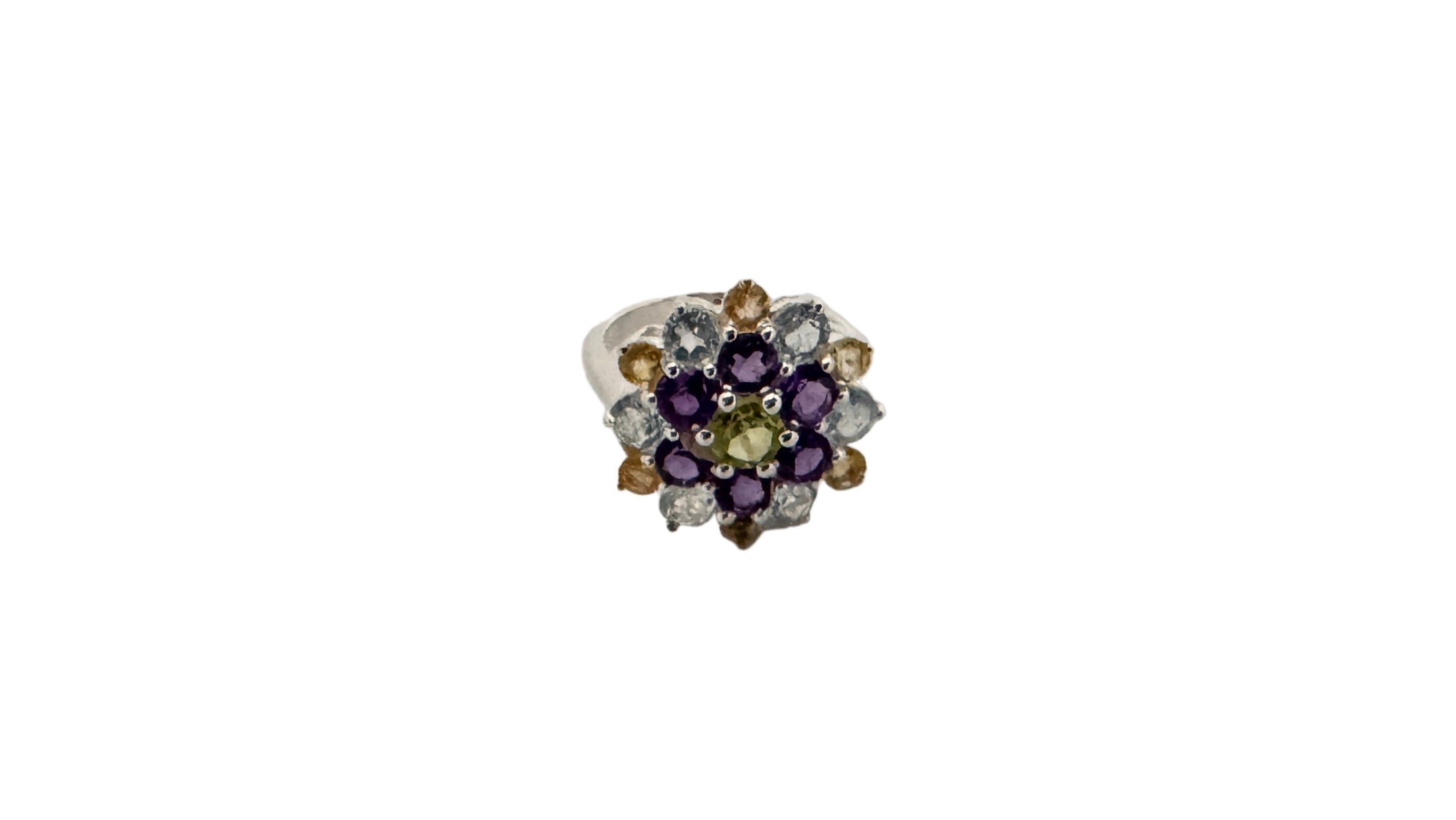 Jewelry ring with multicolored gemstones on a white background