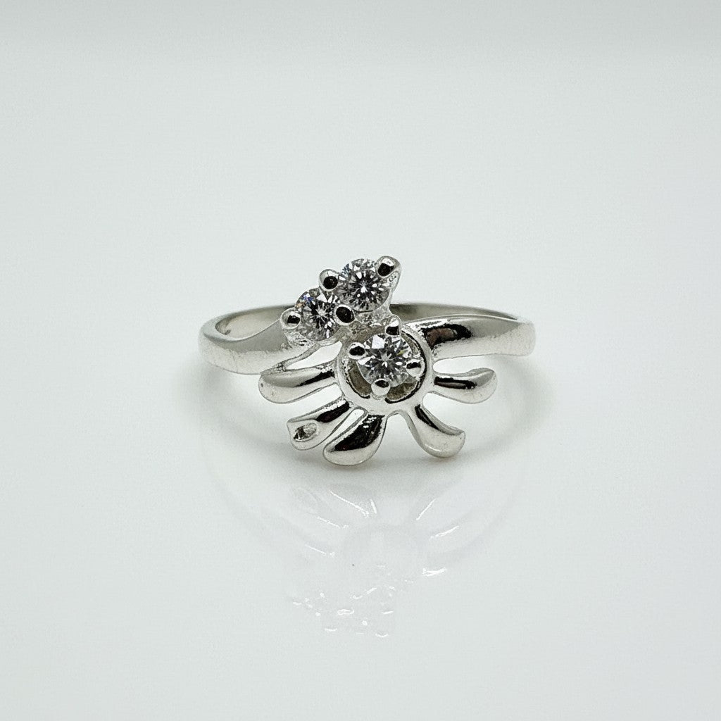 Silver ring with a starfish design on a white background