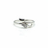 Silver ring with a small diamond on a white background