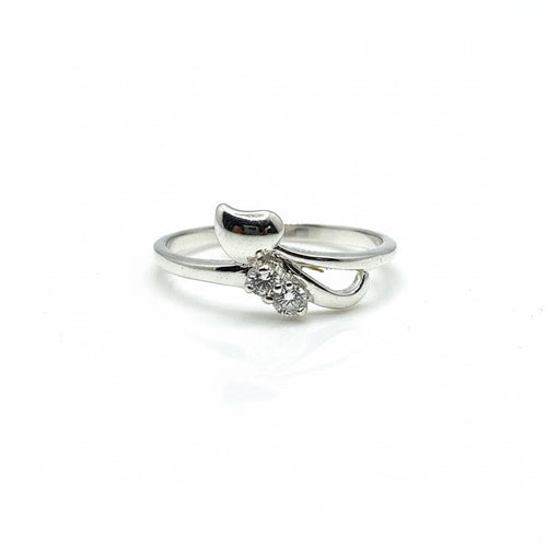 Silver ring with a small diamond on a white background