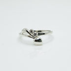 Silver ring with a diamond on a white background