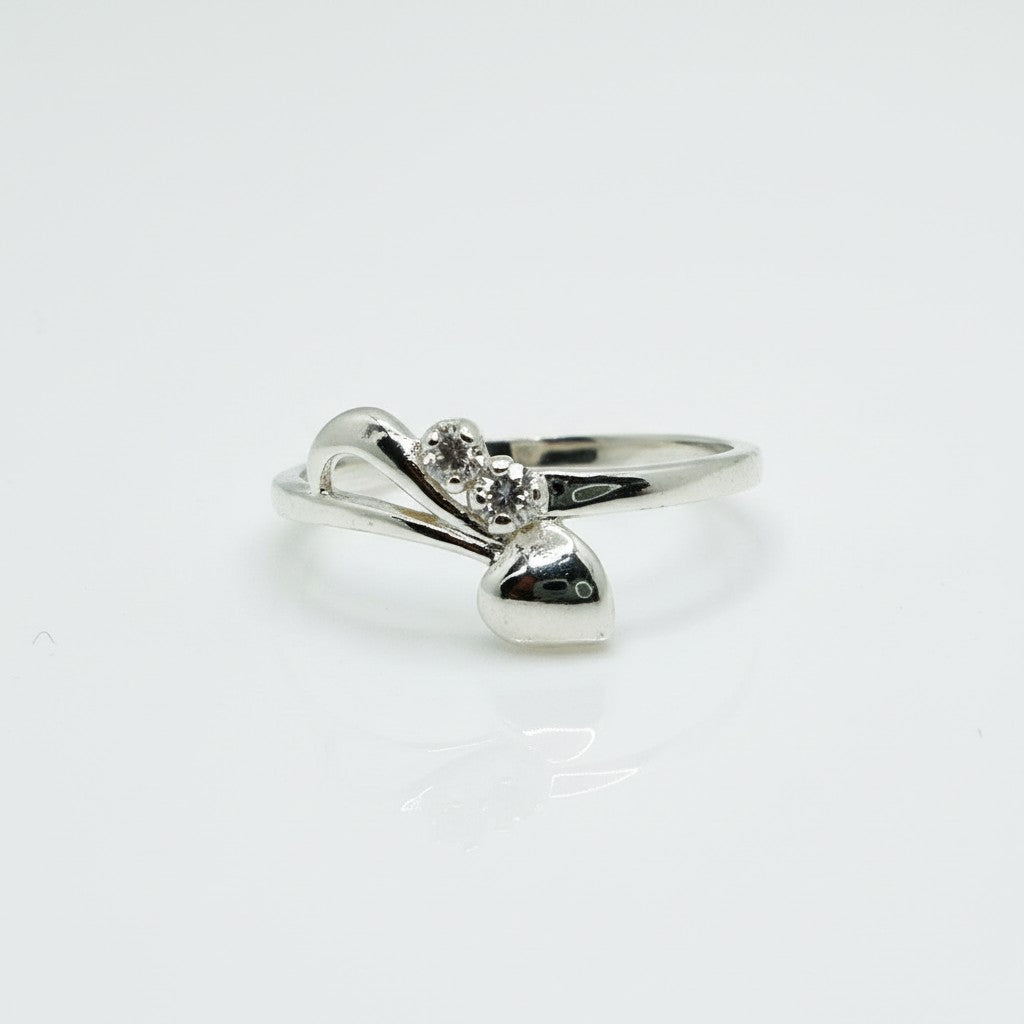 Silver ring with a diamond on a white background