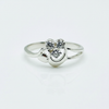 Silver ring with a heart-shaped diamond on a white background