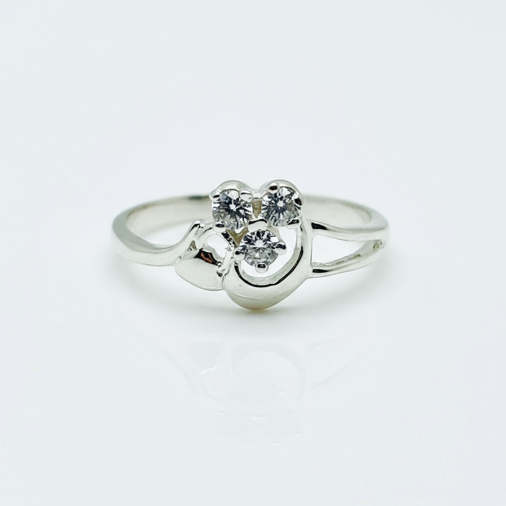 Silver ring with a heart-shaped diamond on a white background