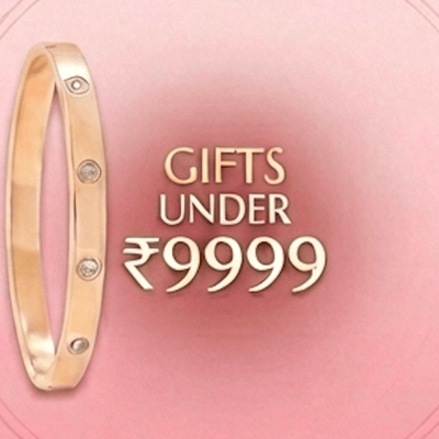 Gold bracelet with diamonds on a pink background with text 'Gifts Under ₹9999'.